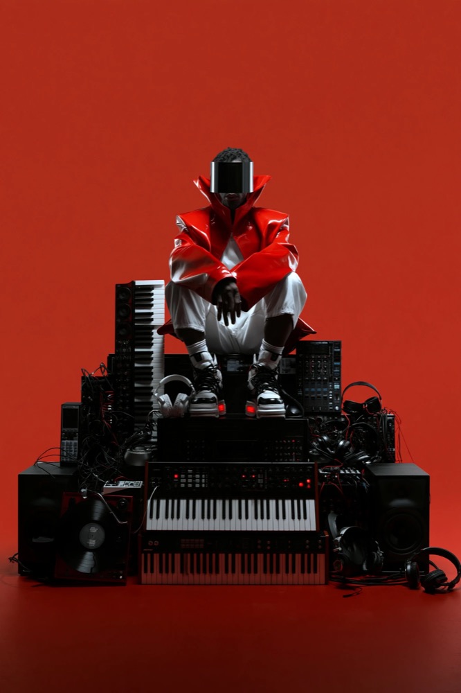A figure in a red vinyl coat and black visor crouches on a tower of synthesizers and speakers